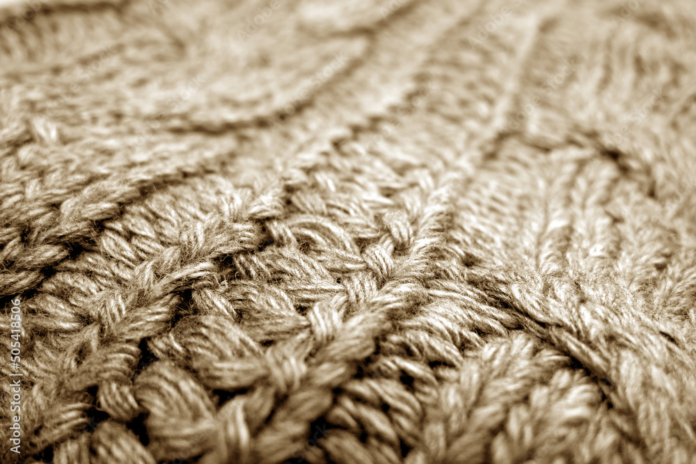 Wall mural Warm knitting texture with blur effect in brown tone.