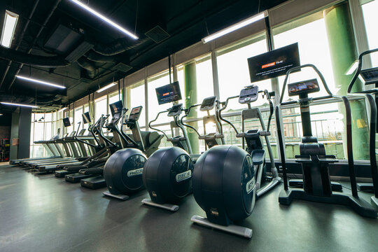 Kyiv, UKRAINE - May 12, 2022: Cardio area with modern Precor USA equipment with Digital screen with internet access