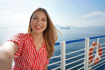 Cruise ship holiday travel vacation. Smiling tourist girl taking selfie on holidays destination on...