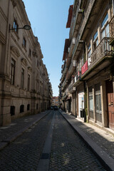 Naklejka na ściany i meble Streets of the city center of Porto on a sunny day in summer 2022.
