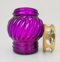 An unquenchable lamp made of purple glass. Candle for the grave with a lid. A memorial candle. A memory candle.