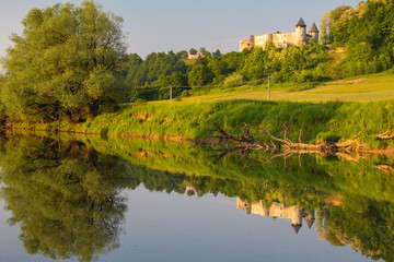 The reflection of Novigrad na Dobri fortress on the Dobra River, Croatia