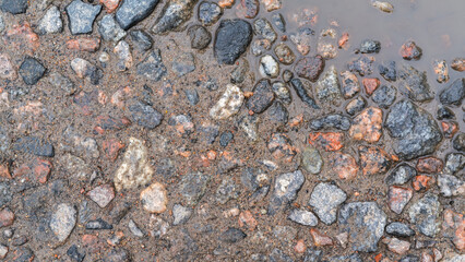 Ground mud sand stones, top view background.
