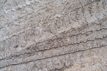 Wheel track on mud, top view background. - obrazy, fototapety, plakaty