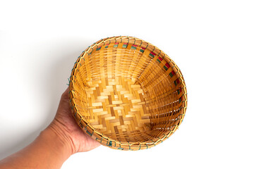 Fototapeta premium Hand holding Bamboo basket isolated on white background. 