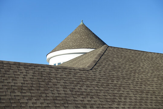 Closeup of a Conical, Cone or Turret Style Roof against a Blue Sky
