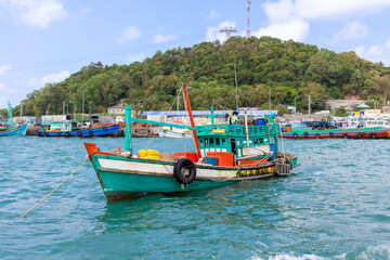 Wooden vietnamese junk fishing boat anchored at sea