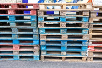Stacked wooden pallets in a fish market