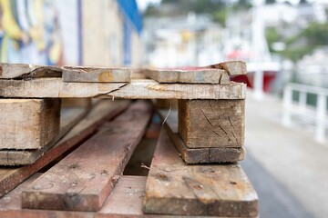 Stacked wooden pallets in a fish market