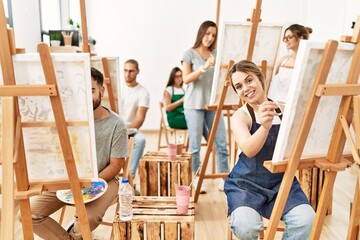 Obraz premium Group of young people smiling happy drawing at art studio