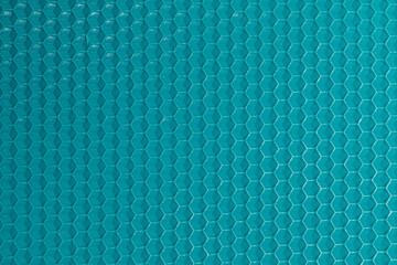 turquoise background with hexagons
