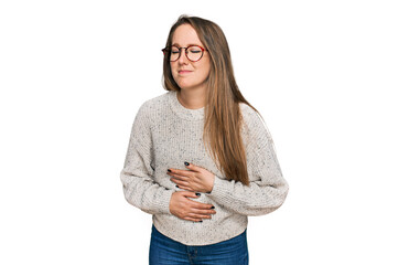 Young blonde woman wearing casual sweater and glasses with hand on stomach because indigestion,...