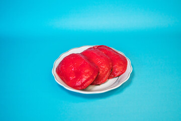 Traditional snacks that are often found in Indonesia, kue ku or kue tok, a fiery red cake filled...