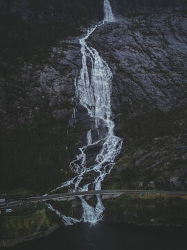 Vertical shot of a rocky waterfall in Langfossen, Norway