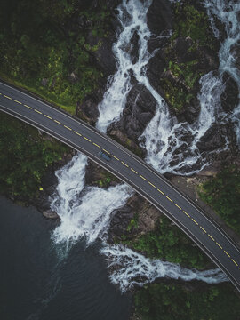 Vertical aerial view of a highway on a mountainous landscape in Langfossen, Norway