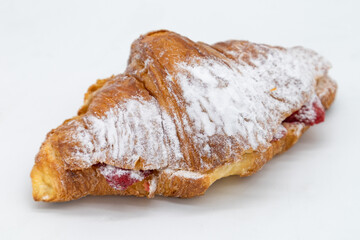 Croissant Stuffed with Strawberries and Topped with Powdered Sugar