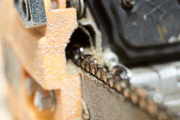 Fragment of chainsaw chain after work