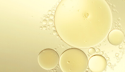 Abstract various yellow bubbles oil or serum with copy space background banner. cosmetic or spa ingredient concept - obrazy, fototapety, plakaty