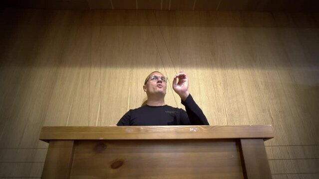 The man businessman making speech at rostrum in business concept. Academic, explaining.