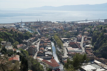 Panorama of Rijeka, the port of Croatia, from the top of Trsat castle with view on river Rjecina passing through the center. In horizon is visible Adriatic Sea and silhouette of coast. 