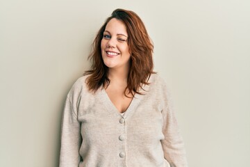 Obraz premium Young caucasian woman wearing casual clothes winking looking at the camera with sexy expression, cheerful and happy face.
