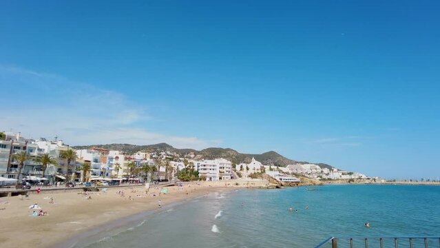POV view towards an open space of San Sebastian beach in Sitges, Costa Dorada, Spain