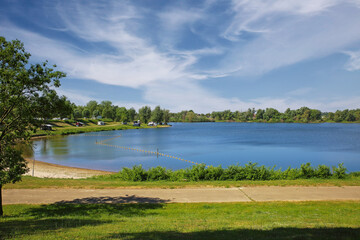 Beautiful dutch countryside landscape, cycle path, camping site swimming lake, forest - Ohe en...