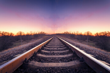 Fototapeta na wymiar Train platform at sunset. Railroad. Railway station
