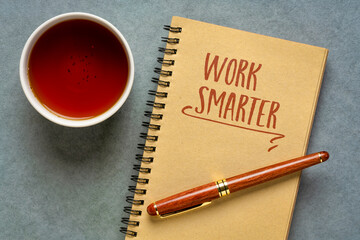 work smarter advice - inspirational handwriting in a spiral notebook with cup of tea, personal development and productivity concept