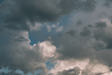 Fototapeta na wymiar Dramatic stormy dark and light clouds before rain, blue sky white clouds as background pattern wallpaper