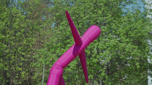 Pink inflatable dancer for advertising and attracting attention dancing in the wind