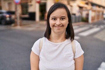 Down syndrome woman smiling confident standing at street