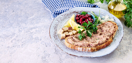 Top view of yummy crunchy bread with homemade vegetarian liverwurst pate served on a plate