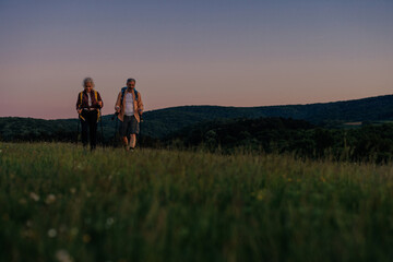 Couple with backpackers exploring nature together
