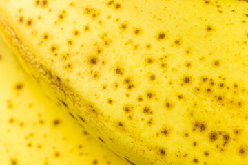 Banana skin close up. Background of ripe banana peel texture. Banana macro photo. Tropical fruit skin wallpaper