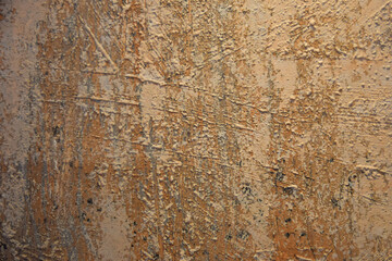flat surface painted unevenly with warm colors 