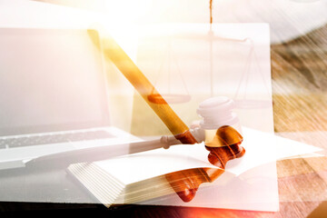Justice and law concept.Male judge in a courtroom with the gavel, working with, computer and...