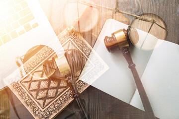 Justice and law concept.Male judge in a courtroom with the gavel, working with, computer and...
