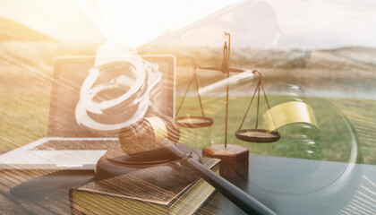 Justice and law concept.Male judge in a courtroom with the gavel, working with, computer and...