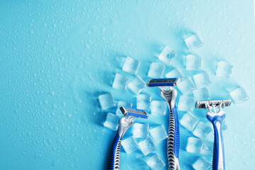 Refreshing shaving machines for the face against the background of frosty ice cubes