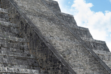 Fototapeta na wymiar Step Pyramid of Kukulkan, Chichen Itza, Mexico. Pyramid staircase made of ancient stone blocks. Mayan civilization city.