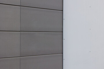 building facade with ventilated facade tiles installed. Modern architectural solutions