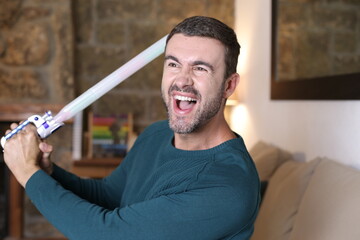 Obraz premium Man holding a laser sword