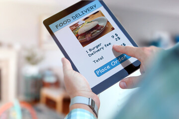 Someone is ordering  food on  the internet using an app, restaurant meals delivery online