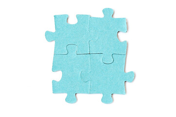 Four puzzle pieces are connected together isolated on a white background. Teamwork concept