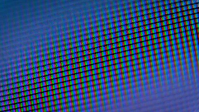 Abstract multicolored glow of RGB pixels close-up, soft focus for background