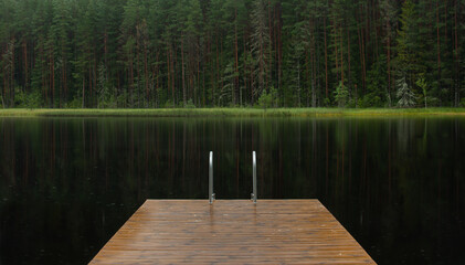 Peaceful swimming place on a vacation at a forest lake with clean water and a quiet environment.