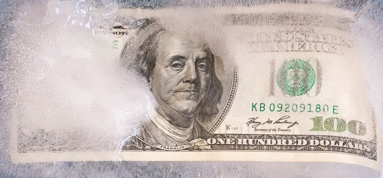 100 US Dollar Frozen Under A Layer Of Ice