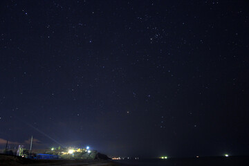 Starry sky and sea coast
