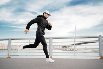 Runner male athlete training in sportswear, active lifestyle, sports running for cardio